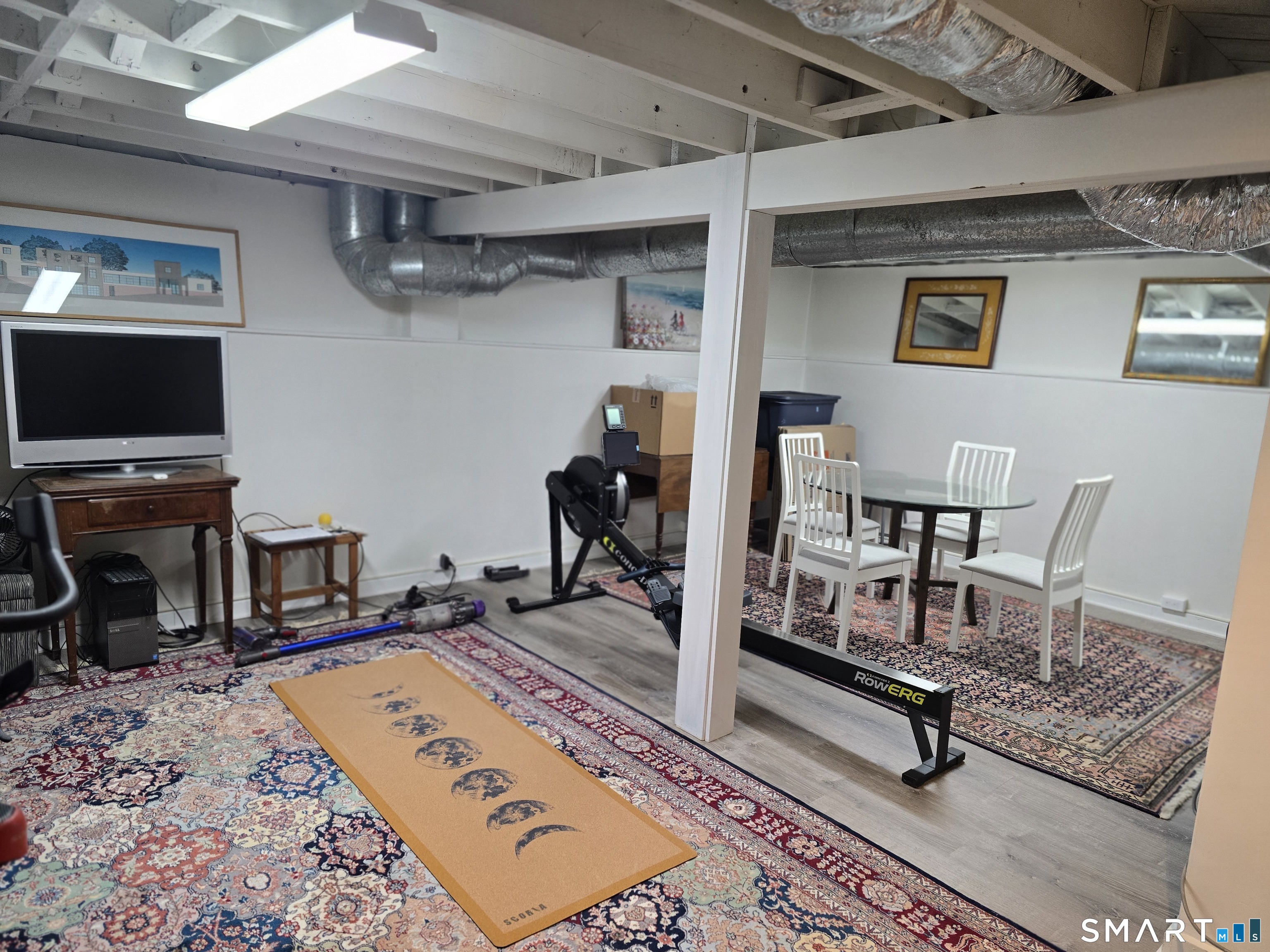 276 Dunnlea Road Fairfield, CT 06824 - Photo 22 of 26 a living room with furniture and a flat screen tv