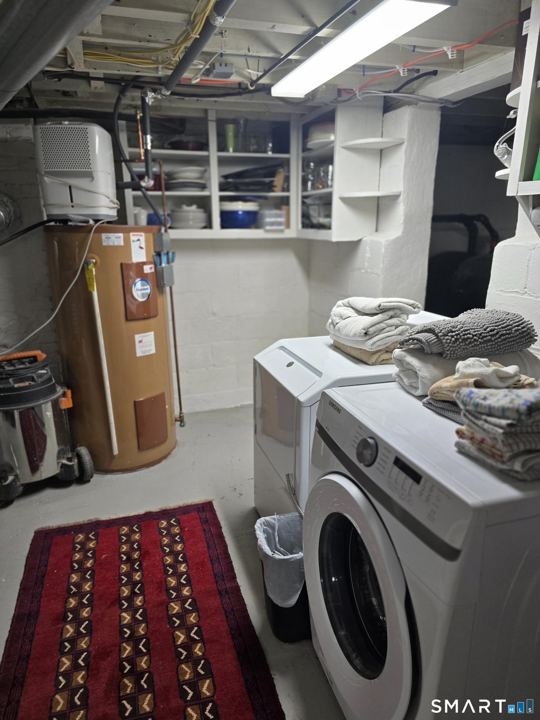 276 Dunnlea Road Fairfield, CT 06824 - Photo 23 of 26 a utility room with dryer and washer