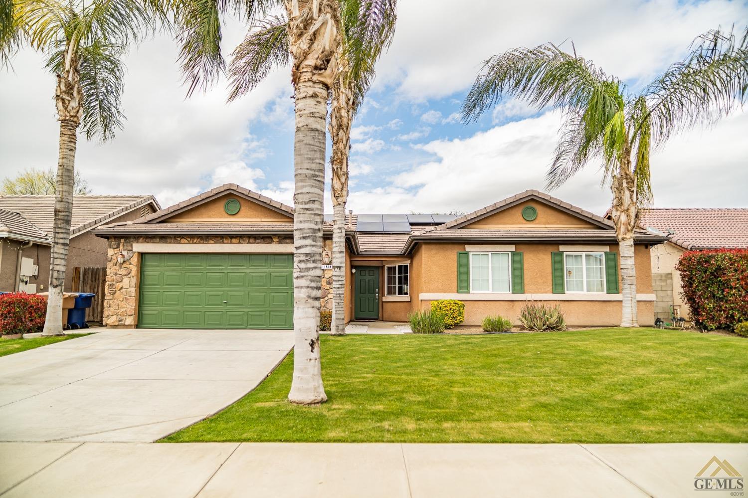 a view of house with yard