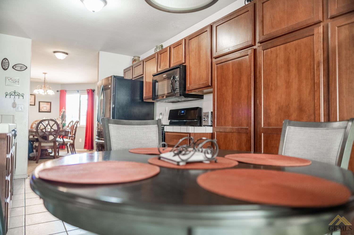 Undisclosed Address Bakersfield, CA 93311 - Photo 13 of 26 a room with furniture and wooden floor