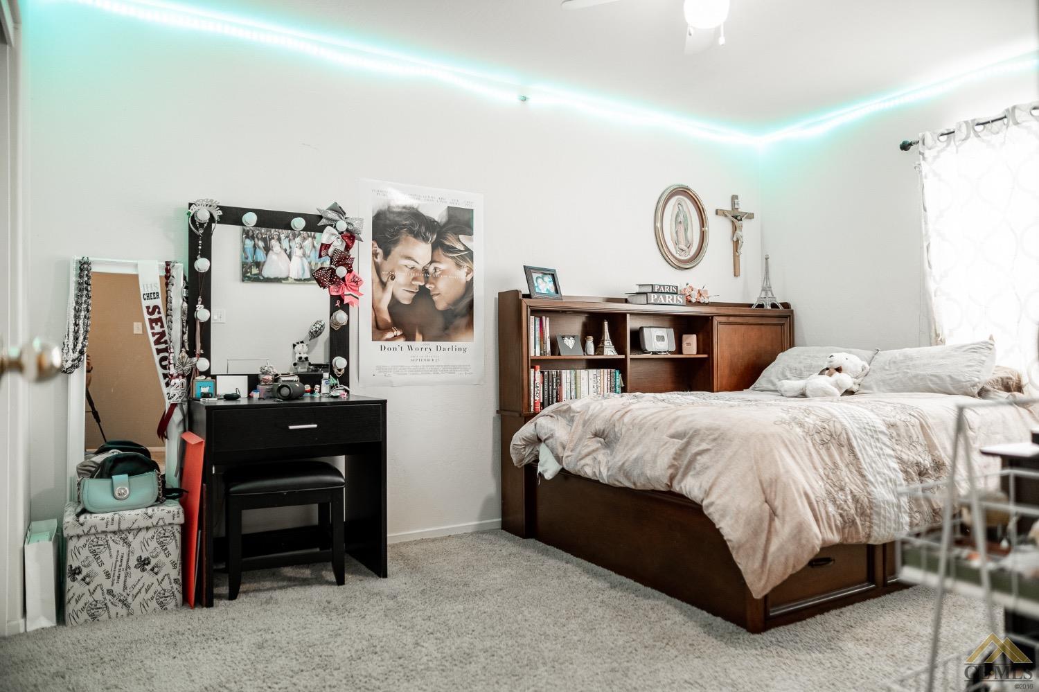 Undisclosed Address Bakersfield, CA 93311 - Photo 17 of 26 a bed room with a bed and a table