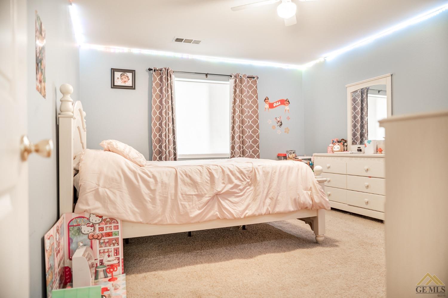 Undisclosed Address Bakersfield, CA 93311 - Photo 20 of 26 a bedroom with a bed and a window