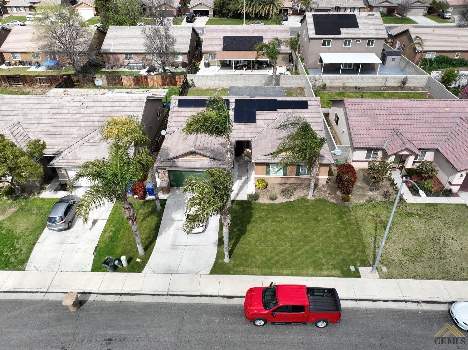 Undisclosed Address Bakersfield, CA 93311 - Photo 2 of 26 an aerial view of a houses with yard