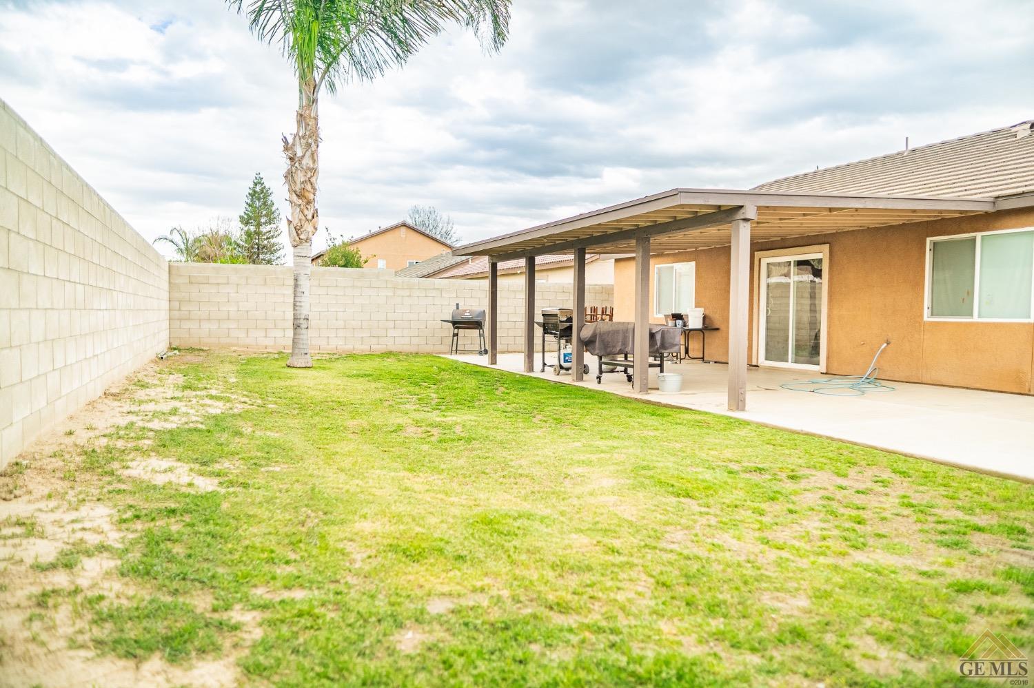 Undisclosed Address Bakersfield, CA 93311 - Photo 24 of 26 a swimming pool with yard and outdoor seating