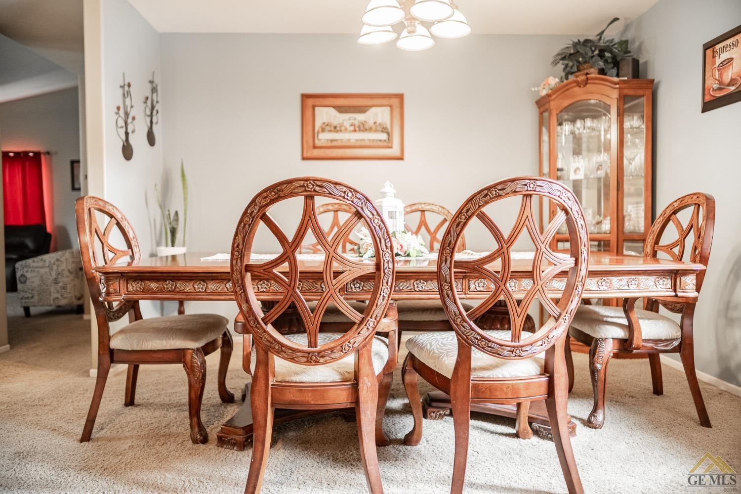 Undisclosed Address Bakersfield, CA 93311 - Photo 6 of 26 a view of a dining room with furniture and chandelier