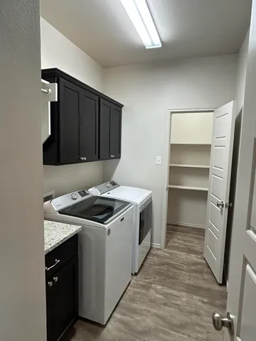 a kitchen with a stove and a microwave