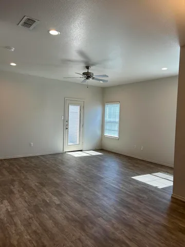 a view of an empty room with a window