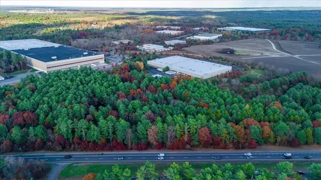 an aerial view of a house with a yard and garden