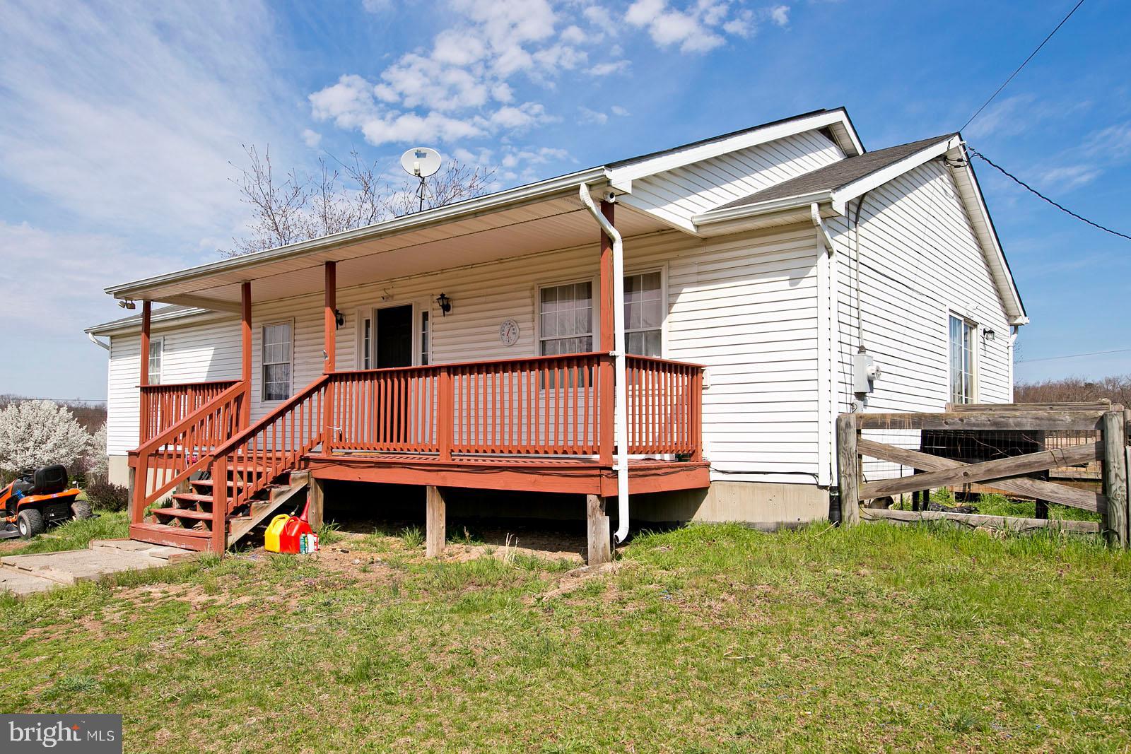 580 Ridgeview Road Capon Bridge, VA 26711 - Photo 1 of 44 Front of home, large porch