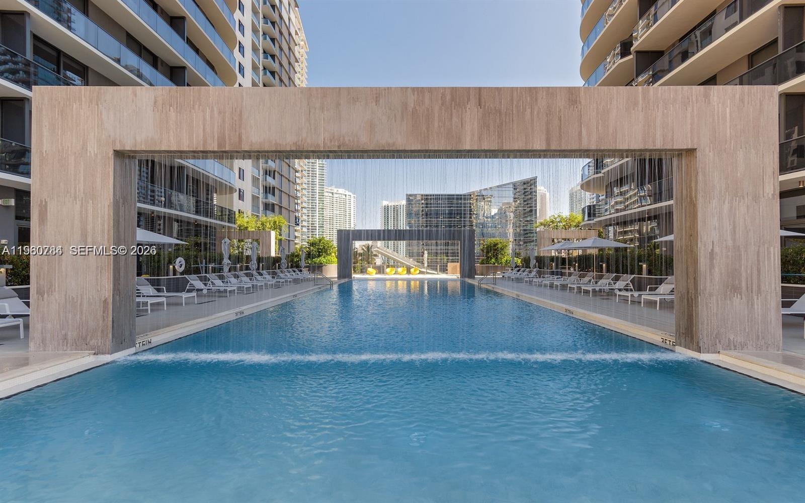 45 Southwest 9th Street, Unit 1805 Miami, FL 33130 - Photo 15 of 22 a view of a patio with table and chairs