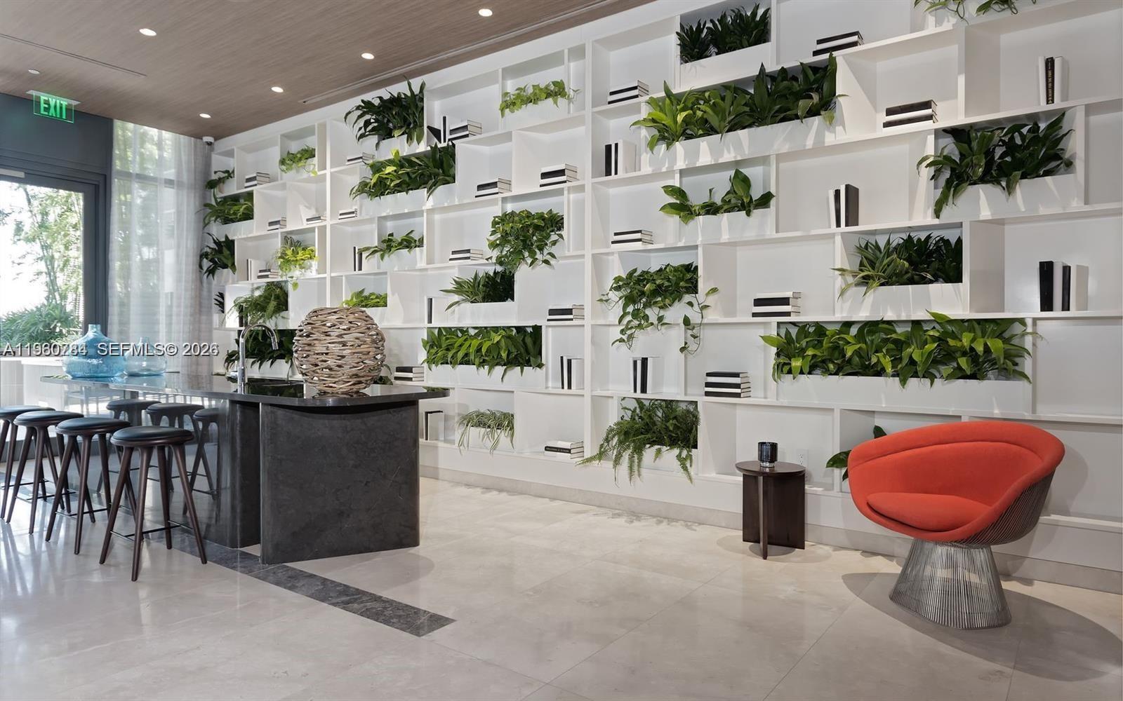 45 Southwest 9th Street, Unit 1805 Miami, FL 33130 - Photo 17 of 22 a kitchen with furniture and a potted plant