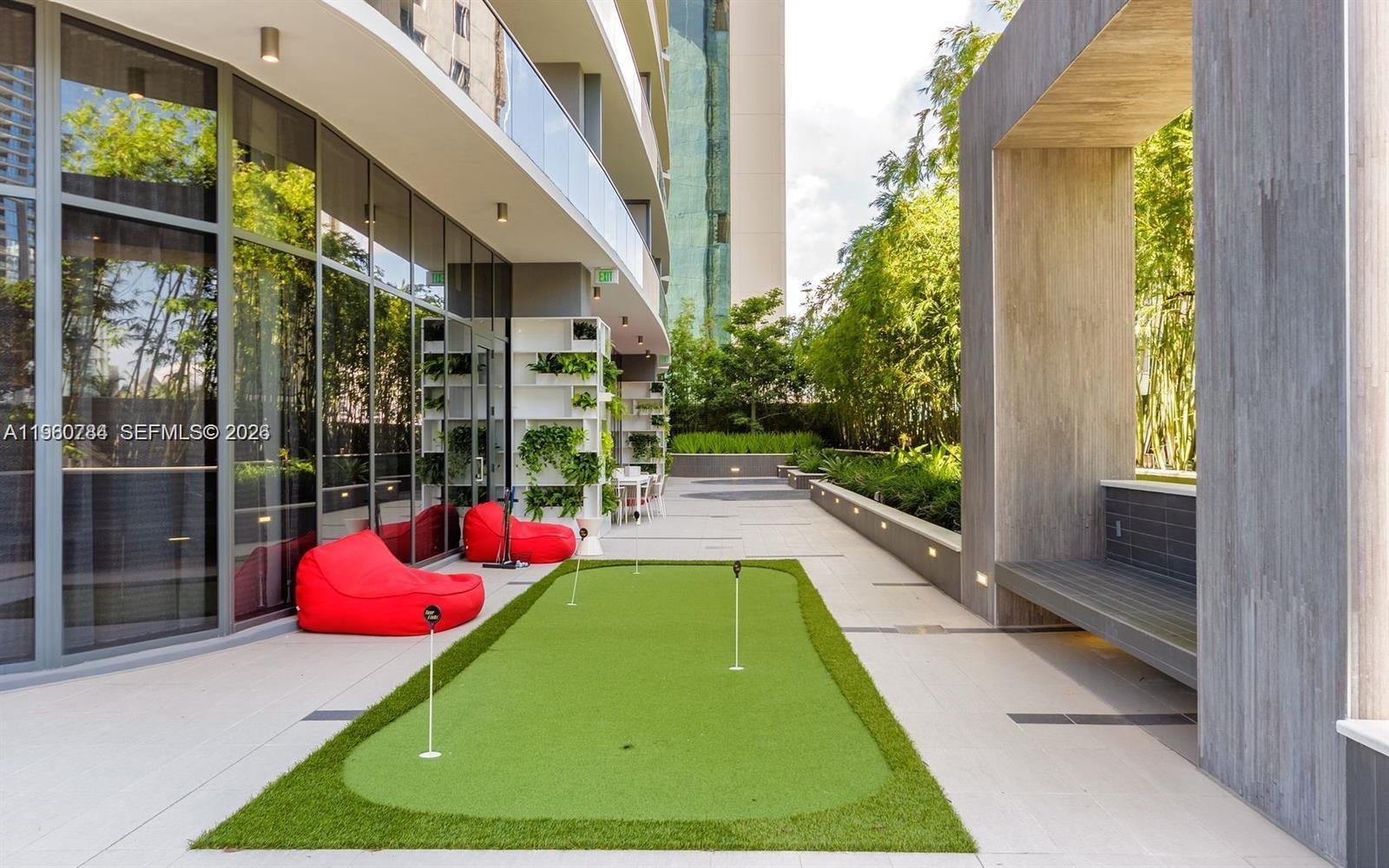 45 Southwest 9th Street, Unit 1805 Miami, FL 33130 - Photo 19 of 22 a room with pool and wooden floor