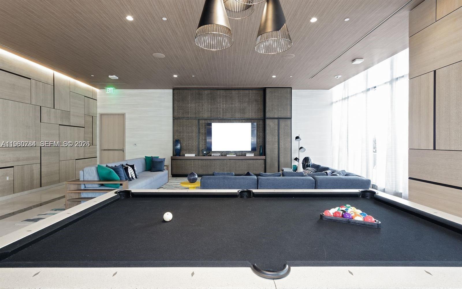 45 Southwest 9th Street, Unit 1805 Miami, FL 33130 - Photo 22 of 22 a living room with kitchen island granite countertop furniture and a potted plant