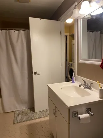 a bathroom with a sink and mirror