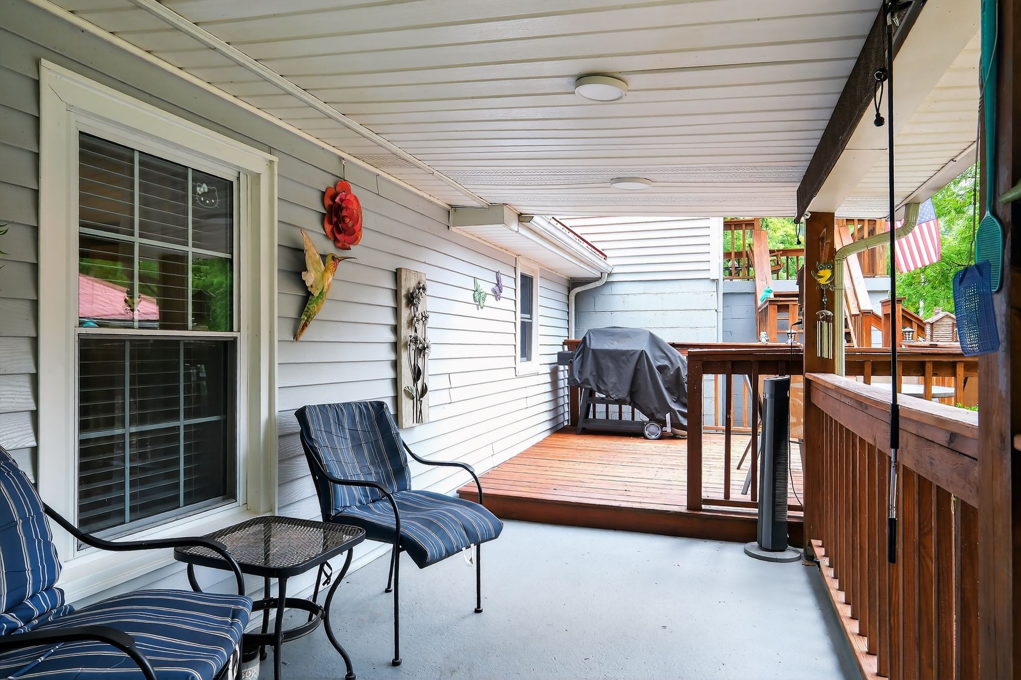 3119 Tyree Springs Road Hendersonville, TN 37075 - Photo 30 of 61 a view of a deck with table and chairs with wooden floor and fence
