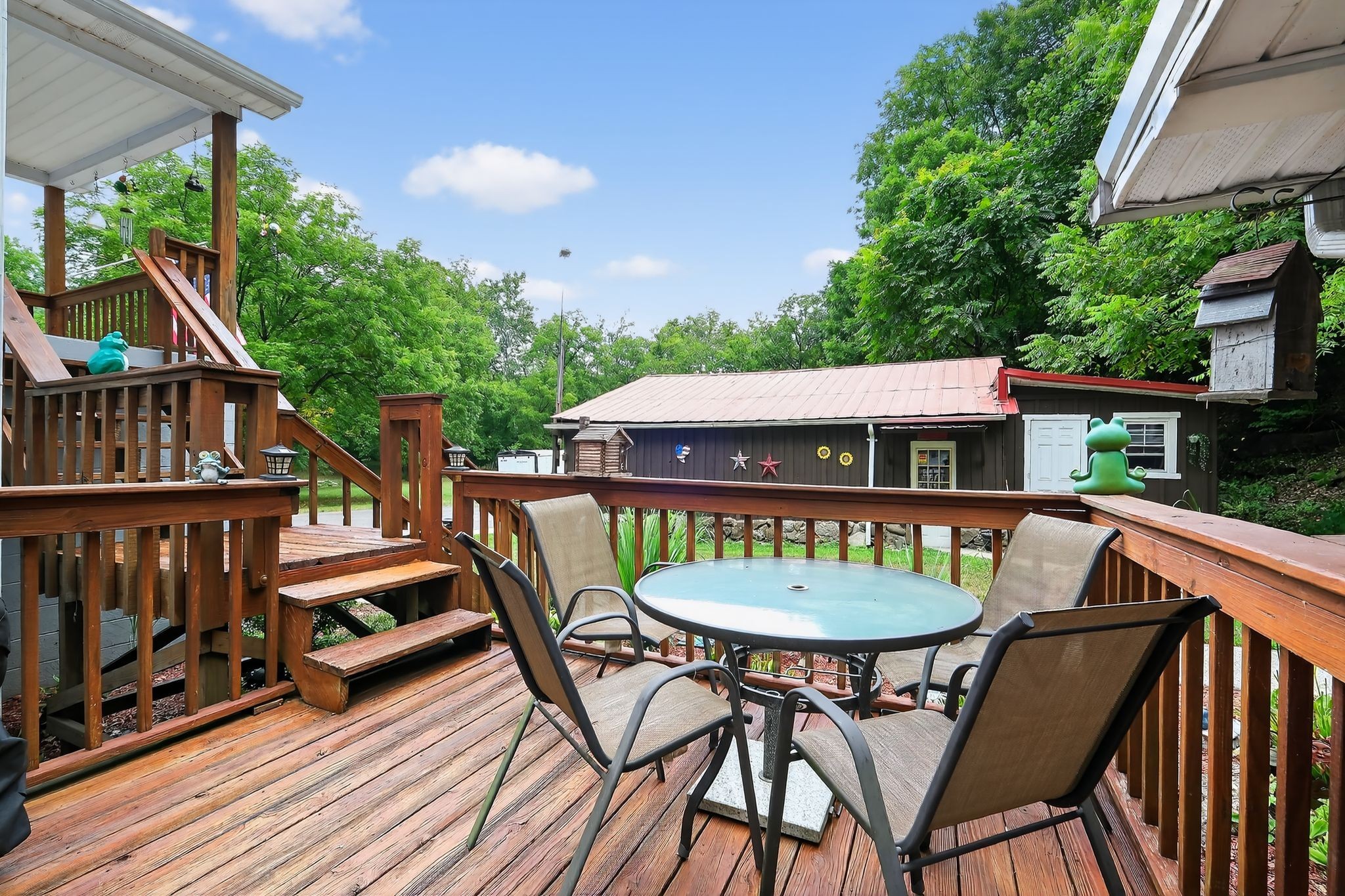 3119 Tyree Springs Road Hendersonville, TN 37075 - Photo 31 of 61 a view of a patio with table and chairs with wooden floor and fence