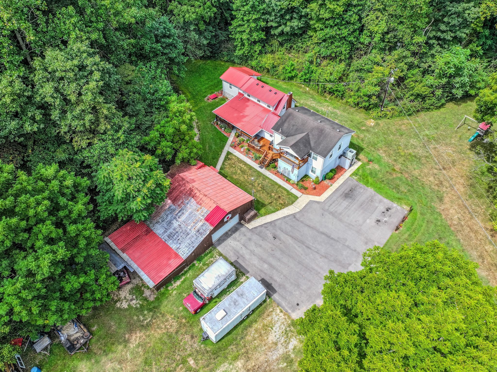 3119 Tyree Springs Road Hendersonville, TN 37075 - Photo 55 of 61 an aerial view of a house with a yard and a car park