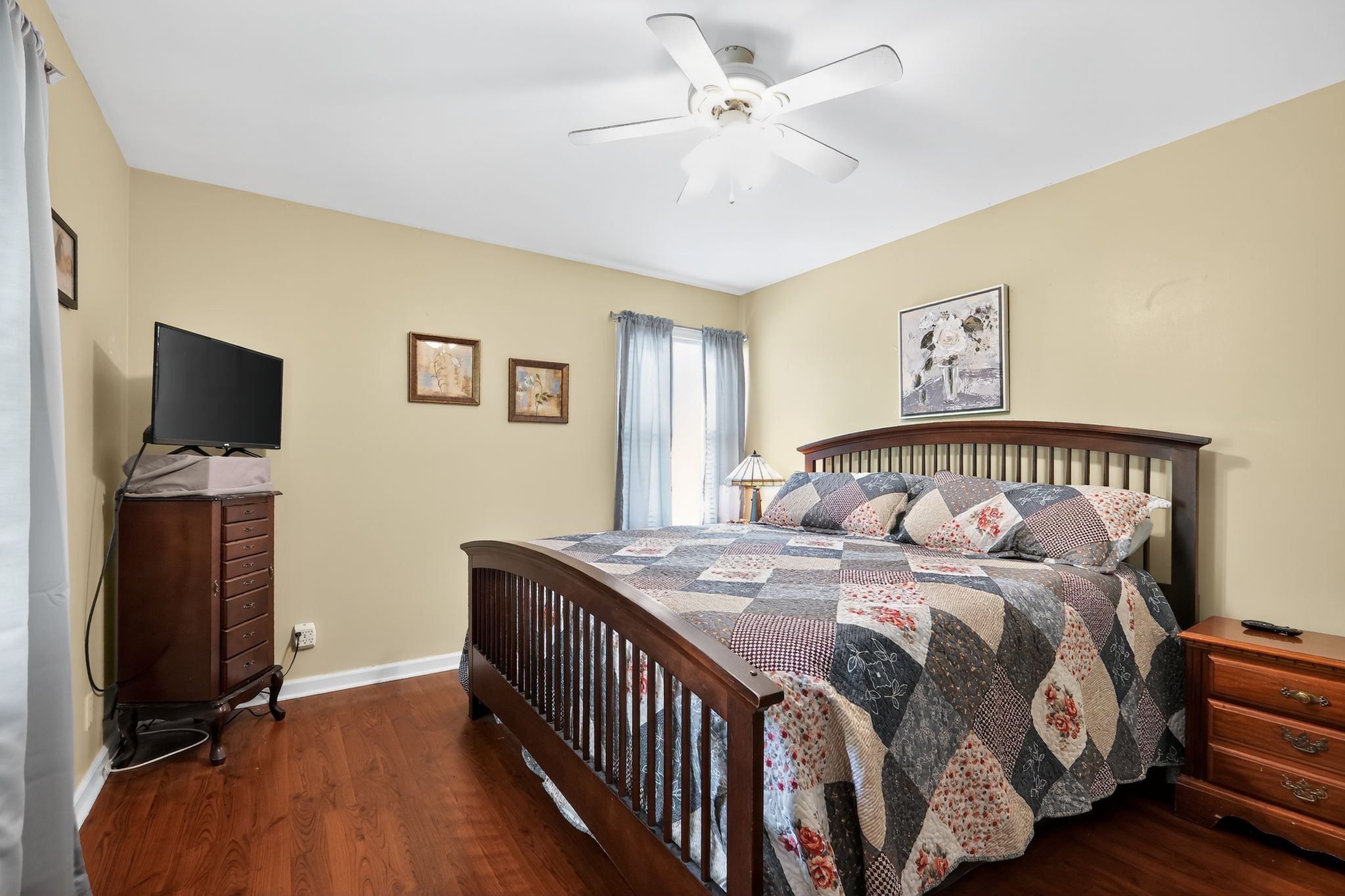 3119 Tyree Springs Road Hendersonville, TN 37075 - Photo 8 of 61 a bedroom with a bed and a flat tv screen on the dresser
