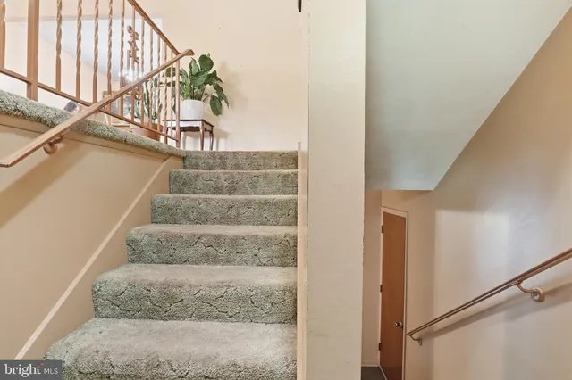 a bedroom with bed and window