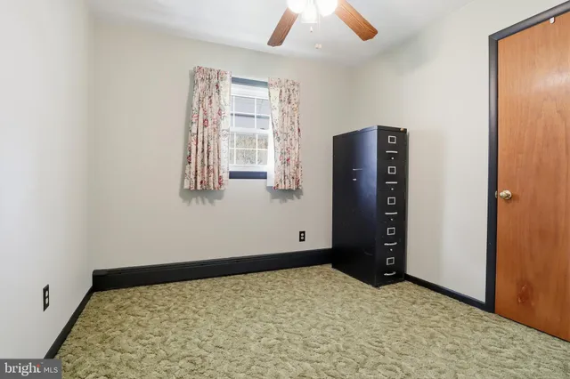 a bedroom with furniture and flat screen tv