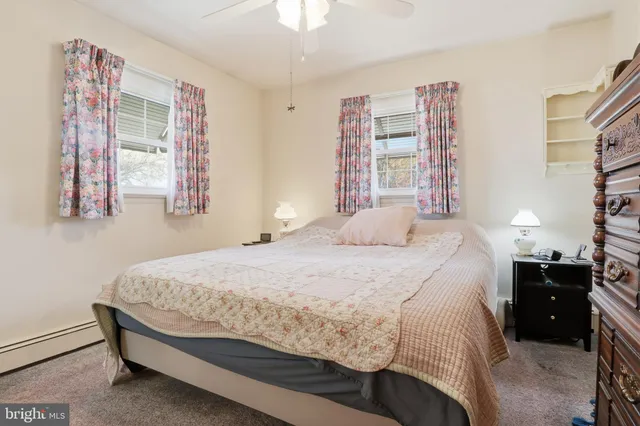 a bathroom with a double vanity sink mirror and shower