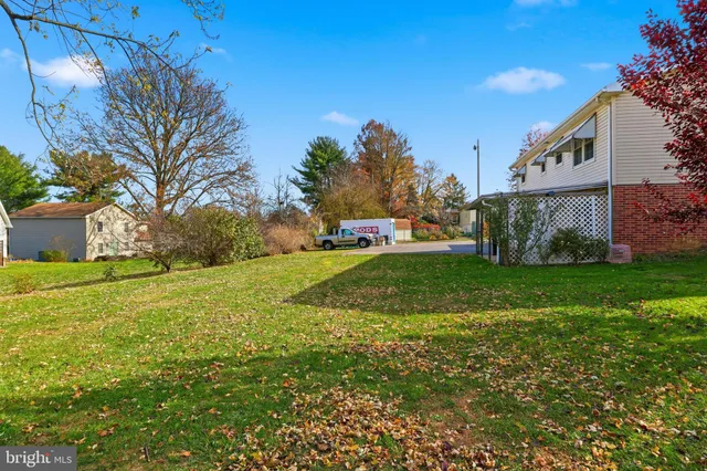 an aerial view of a house with outdoor space