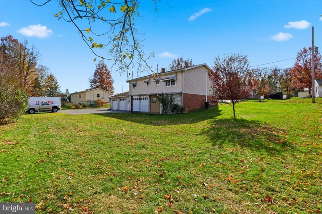 a view of a garden with houses