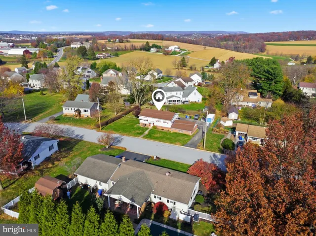 an aerial view of residential houses with outdoor space