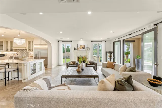 a living room with furniture flat screen tv and a fireplace