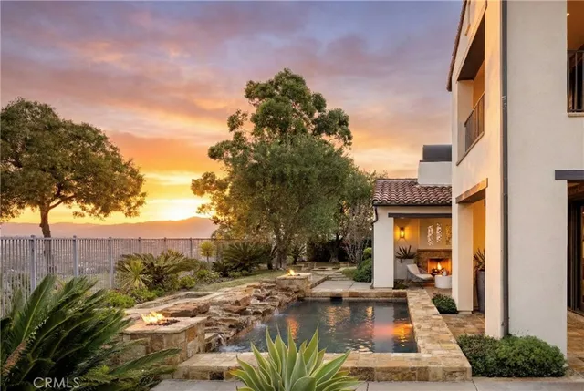 a large bathroom with a tub sink shower and mirror