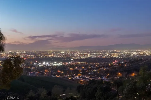 a living room with furniture a window and a fireplace