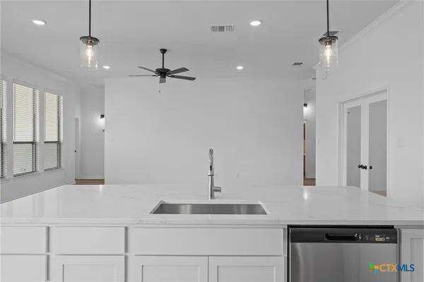 a bathroom with a sink vanity and a mirror