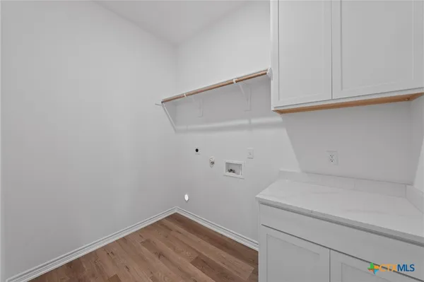 a view of storage and utility room with washer and dryer