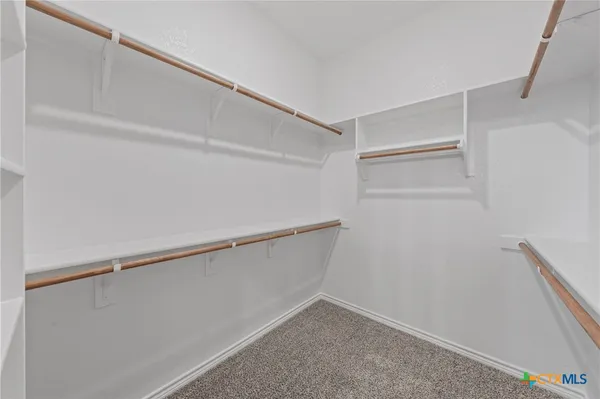 a view of an empty walk in closet
