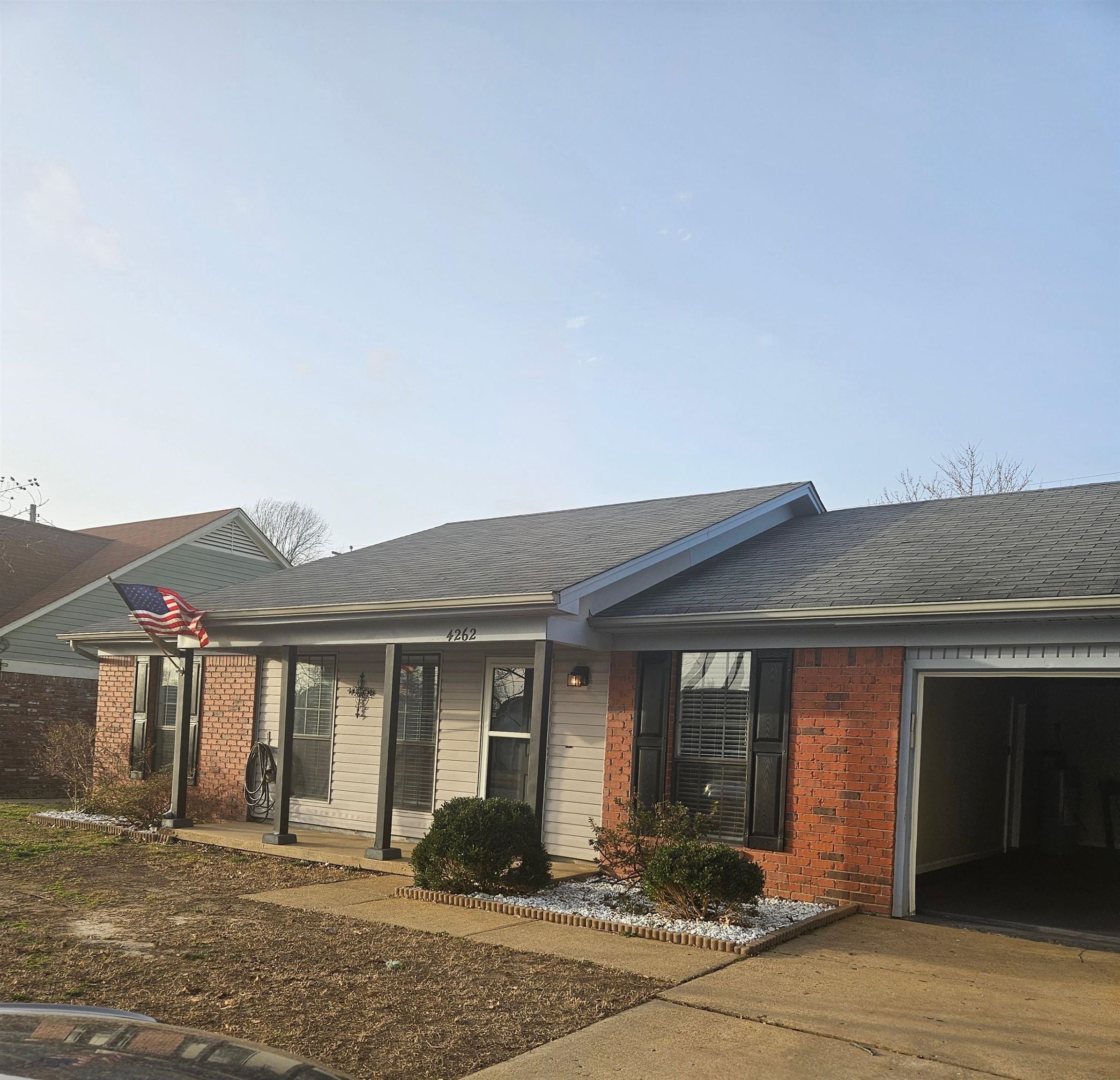 4262 Water Briar Road Millington, TN 38053 - Photo 1 of 21 Single story home with a porch, brick siding, roof with shingles, and an attached garage