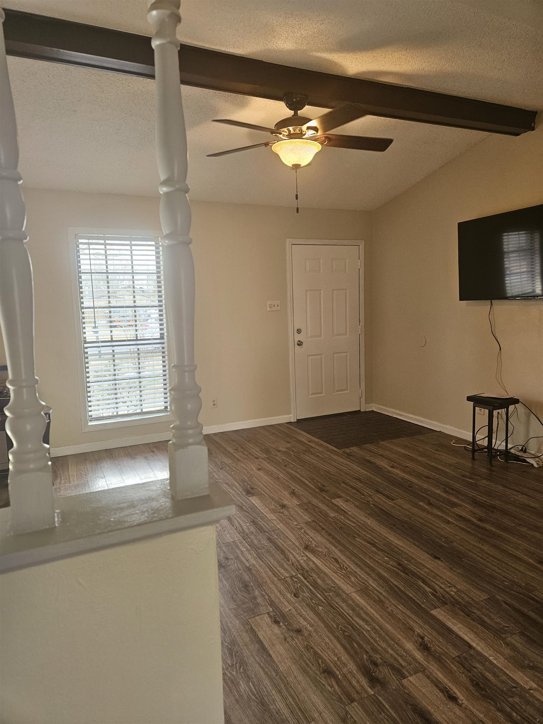 4262 Water Briar Road Millington, TN 38053 - Photo 3 of 21 Foyer with dark wood-style floors, a textured ceiling, baseboards, and vaulted ceiling with beams