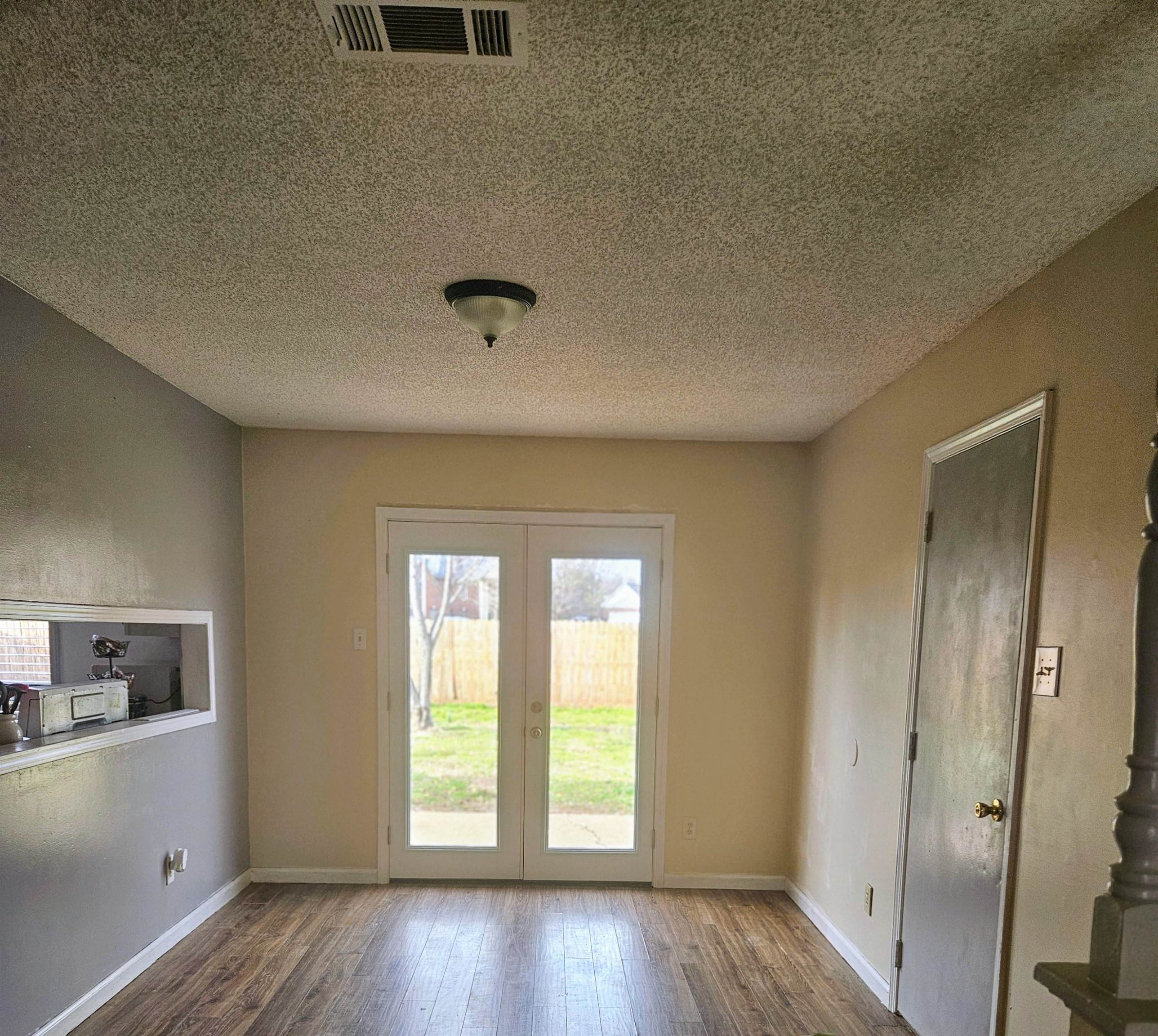 4262 Water Briar Road Millington, TN 38053 - Photo 4 of 21 Doorway to outside featuring french doors, wood finished floors, visible vents, and baseboards
