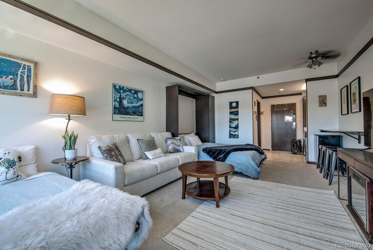 1211 West Keystone Road, Unit 2738 Keystone, CO 80435 - Photo 2 of 23 a living room with furniture and a wooden floor