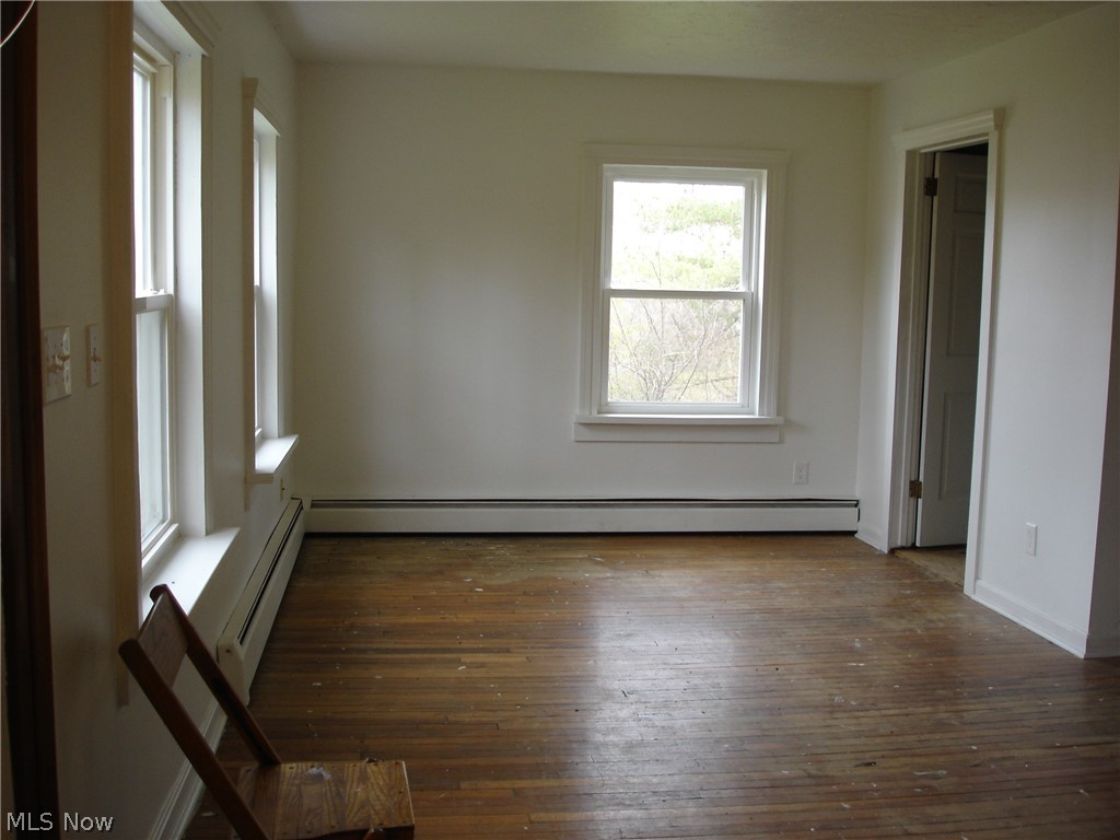 9733 Madison Road Montville, OH 44064 - Photo 18 of 31 Living room. The door to the right is an office area.