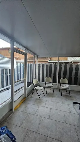 a white toilet sitting next to a shower