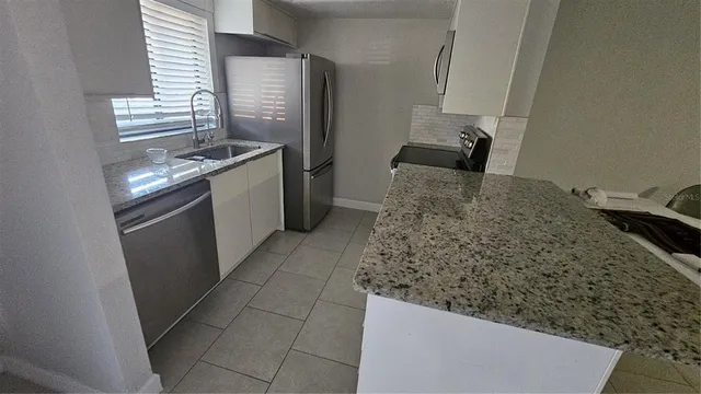 a bathroom with a sink and mirror