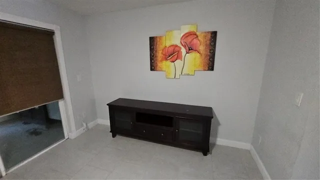 a bedroom with a bed and dresser