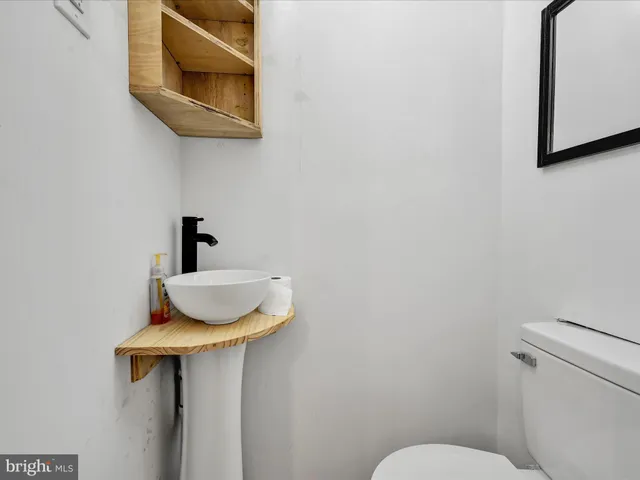 a view of a room with furniture and window