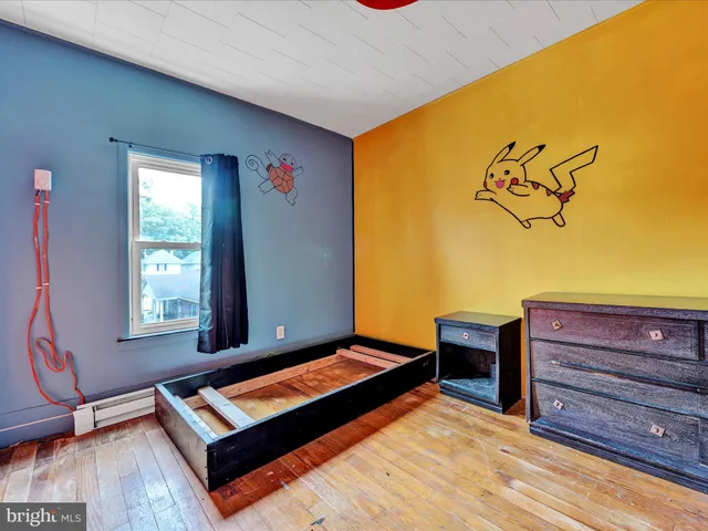 a living room with furniture and large windows