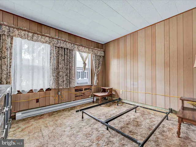 a living room with furniture and a gate