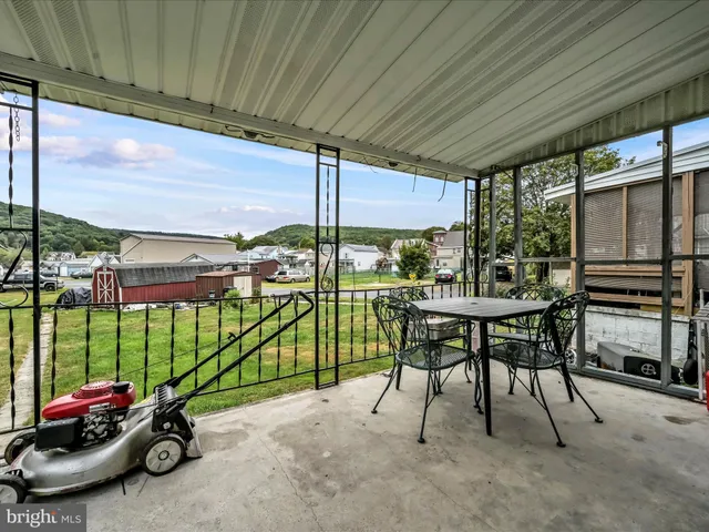 a view of a green field with houses