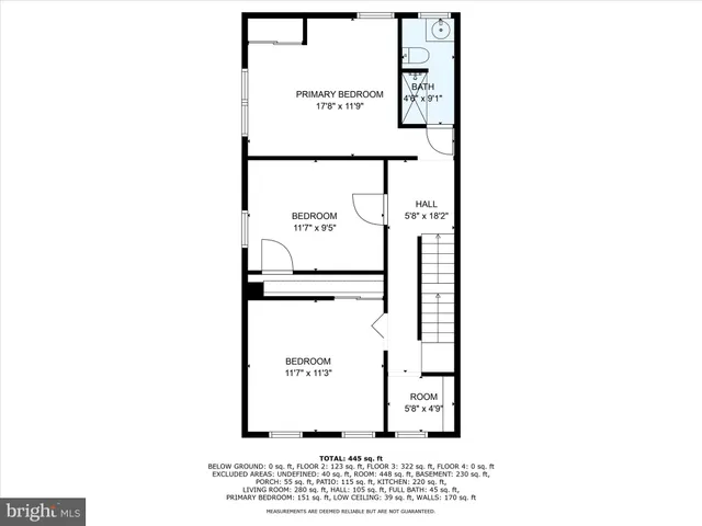 a picture of a bench in front of a wall