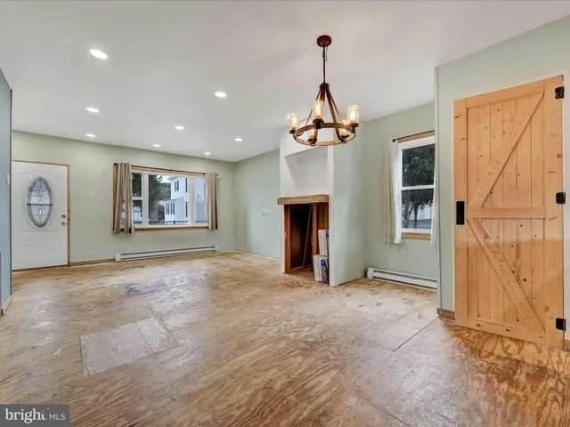 a view of livingroom with window and fireplace