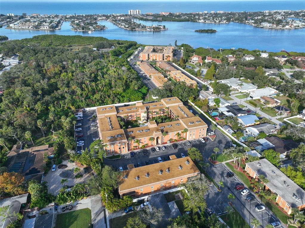 12760 Indian Rocks Road, Unit 413 Largo, FL 33774 - Photo 16 of 27 an aerial view of a city with lots of residential buildings ocean and mountain view in back