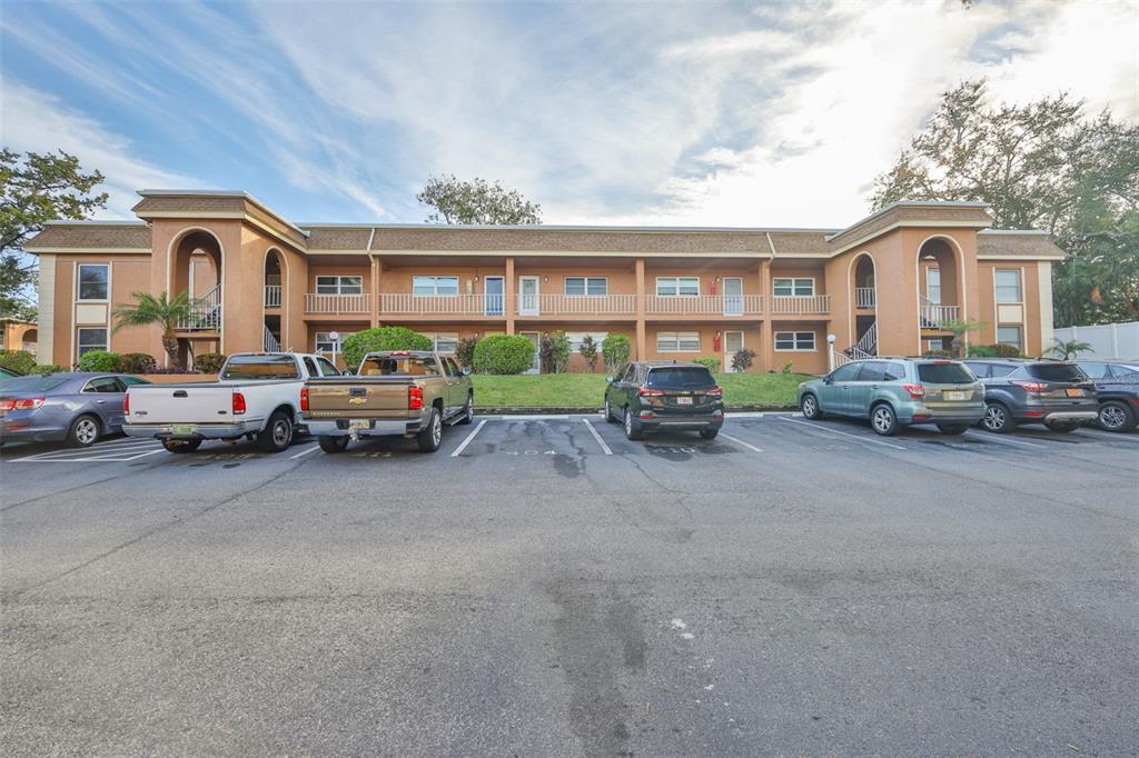 12760 Indian Rocks Road, Unit 413 Largo, FL 33774 - Photo 27 of 27 a group of cars parked in front of a house